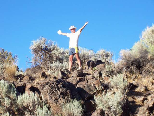 Visitor enjoying the energy atop Pluto's Cave